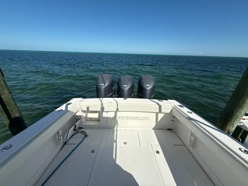 Slide: The Image of 2008 Jupiter 38 boat with triple engines on open sea. - 6