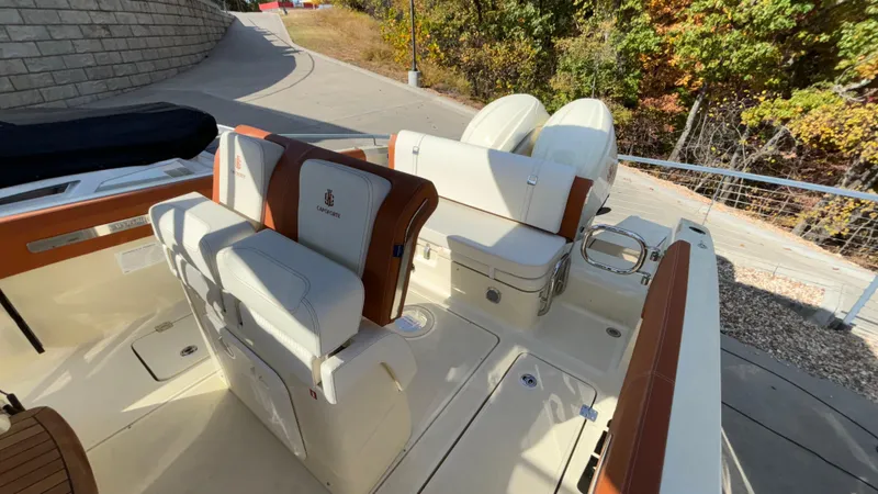 Slide: The Image of 2024 Capoforte FX270 boat interior with luxurious seating and dual engines. - 10