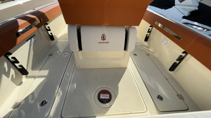 Slide: The Image of 2024 Capoforte FX270 boat interior with seating and storage compartments. - 15