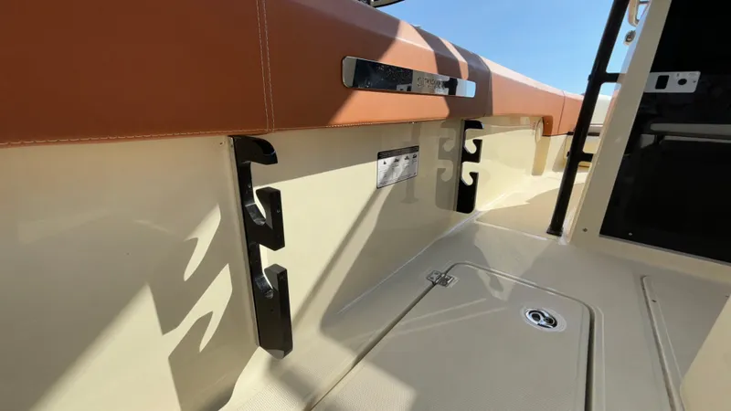 Slide: The Image of Interior view of 2024 Capoforte FX270 boat, featuring sleek design and storage compartments. - 19