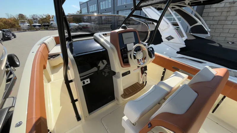 Slide: The Image of 2024 Capoforte FX270 boat interior with modern helm and seating. - 20