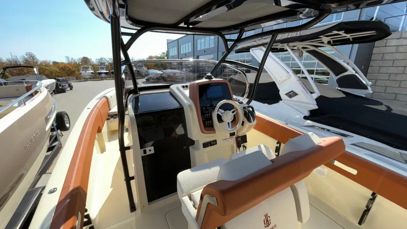 Slide: The Image of 2024 Capoforte FX270 boat interior with modern dashboard and seating. - 21