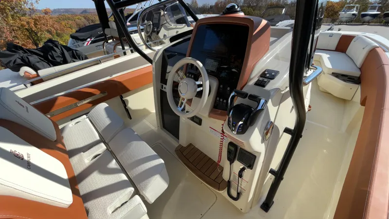 Slide: The Image of 2024 Capoforte FX270 boat interior with modern steering and seating. - 24
