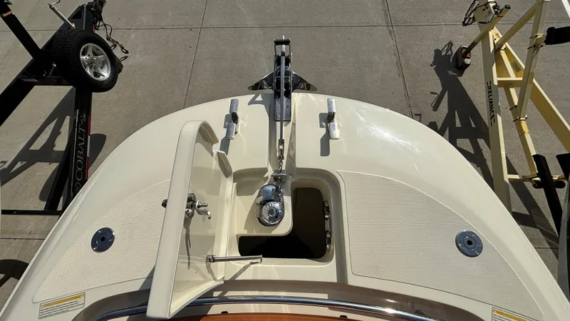 Slide: The Image of 2024 Capoforte FX270 boat bow with anchor and open hatch on trailer. - 31