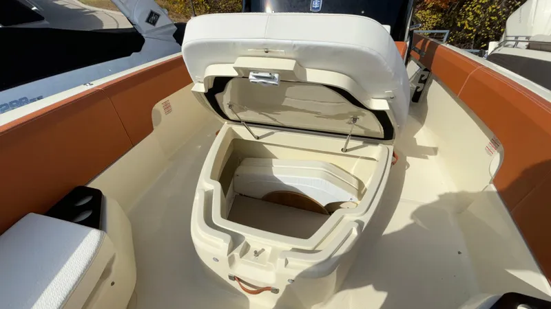 Slide: The Image of 2024 Capoforte FX270 boat with open storage compartment, showcasing interior design. - 39