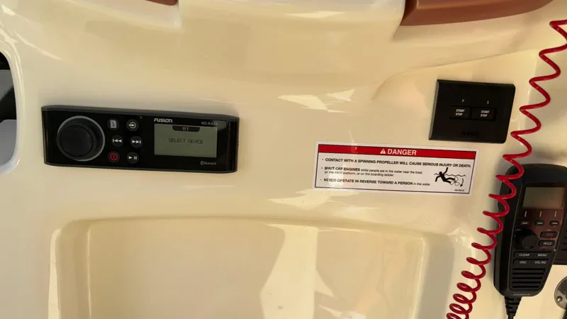 Slide: The Image of Control panel of 2024 Capoforte FX270 boat with safety warning label. - 46