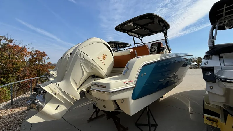 Slide: The Image of 2024 Capoforte FX270 boat with powerful outboard motor, sleek design, and modern features. - 5