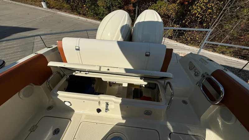 Slide: The Image of 2024 Capoforte FX270 boat interior with open storage compartments. - 9