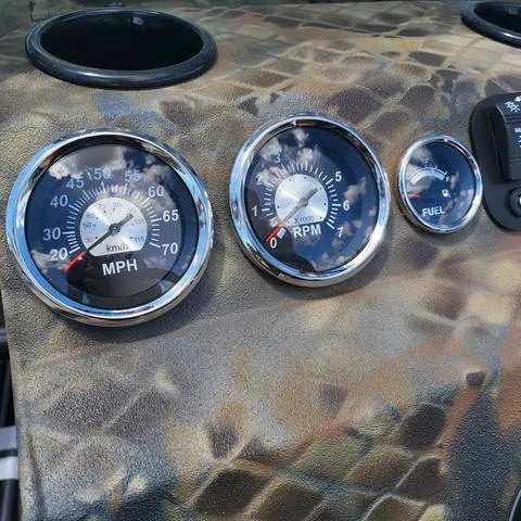 Slide: The Image of Dashboard of 2025 Excel 1860SWV4 boat with speedometer, RPM, and fuel gauges. - 13