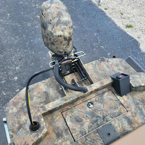 Slide: The Image of 2025 Excel 1860SWV4 Shallow Water F4 boat with camo design and motor. - 16