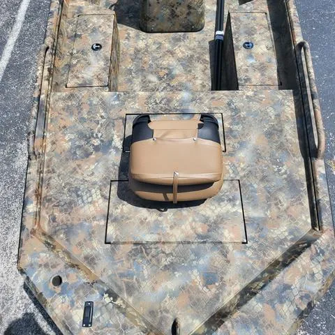 Slide: The Image of 2025 Excel 1860SWV4 Shallow Water F4 boat with camouflage design and console seat. - 4
