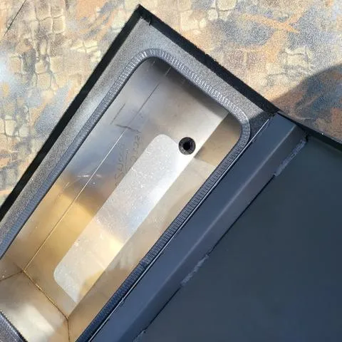 Slide: The Image of Close-up of Excel 1860SWV4 Shallow Water F4 Console Series boat compartment, 2025 model. - 6