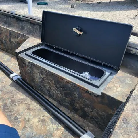 Slide: The Image of Open storage compartment in 2025 Excel 1860SWV4 Shallow Water F4 Console boat. - 9