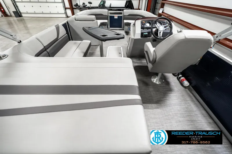 Slide: The Image of 2021 Bennington 22SX boat interior with modern seating and steering console. - 16
