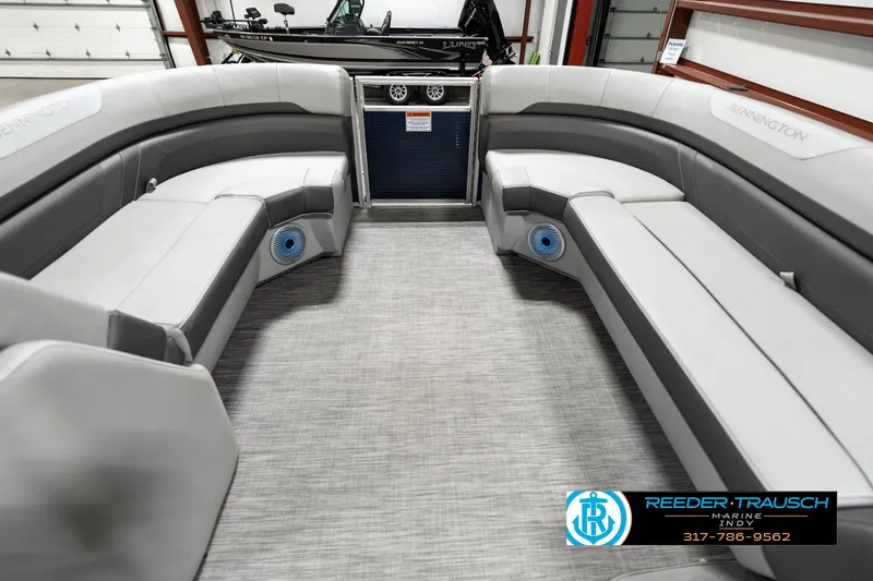 Slide: The Image of 2021 Bennington 22SX pontoon boat interior with gray seating and carpet flooring. - 18