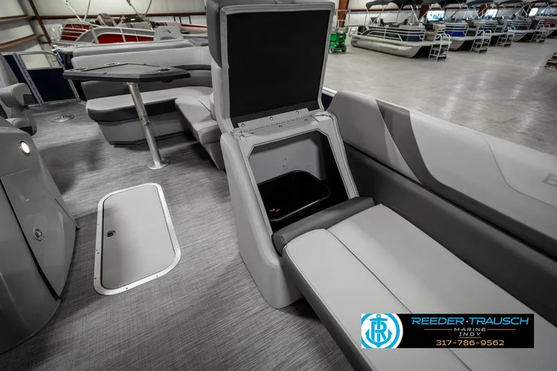 Slide: The Image of 2021 Bennington 22SX pontoon boat interior with storage compartment open. - 21