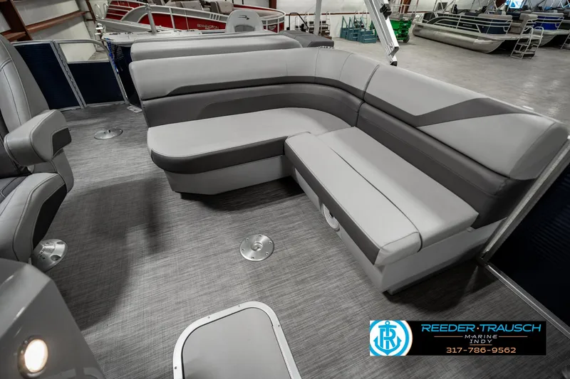 Slide: The Image of 2021 Bennington 22SX boat interior with gray seating and carpeted floor. - 24