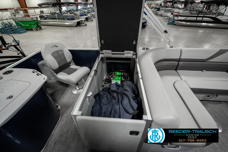 Slide: The Image of 2021 Bennington 22SX pontoon boat interior with seating and storage compartment. - 28