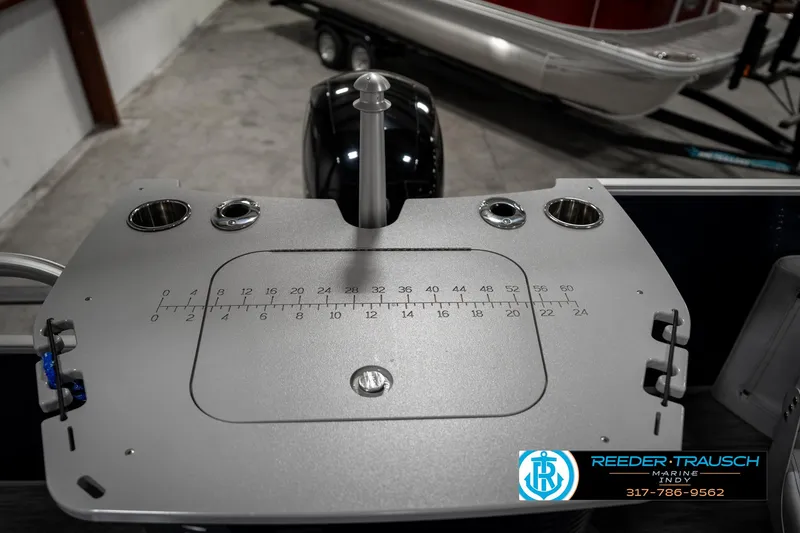 Slide: The Image of Bennington 22SX 2021 boat dashboard with cup holders and measurement markings. - 29