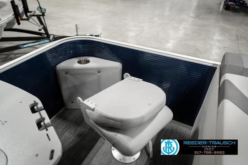 Slide: The Image of 2021 Bennington 22SX boat interior with gray seating and cup holder. - 32