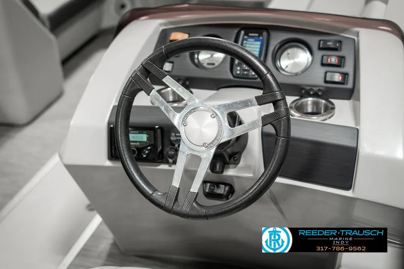 Slide: The Image of 2021 Bennington 22SX boat steering wheel and dashboard controls. - 33