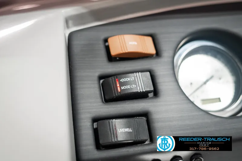 Slide: The Image of Control panel of 2021 Bennington 22SX boat with switches and gauge. - 36