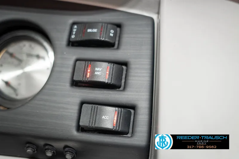 Slide: The Image of Close-up of 2021 Bennington 22SX boat control panel with switches and gauge. - 40