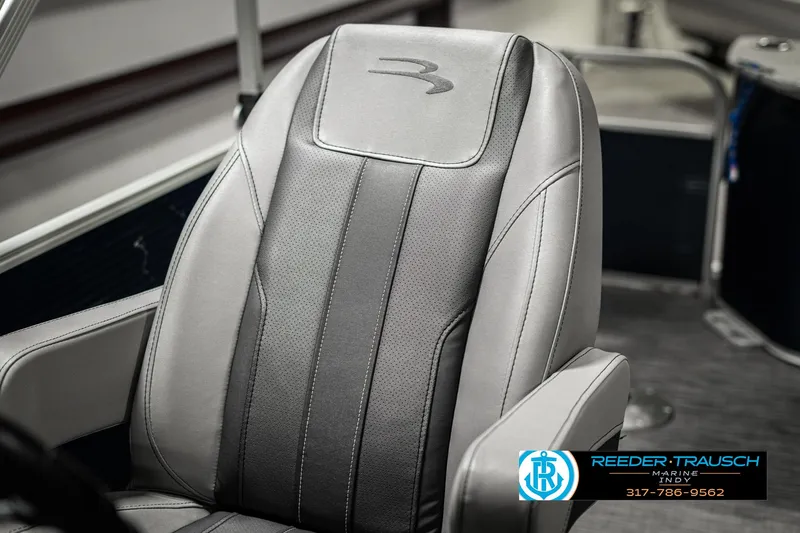 Slide: The Image of 2021 Bennington 22SX boat seat with sleek gray upholstery and logo detail. - 43