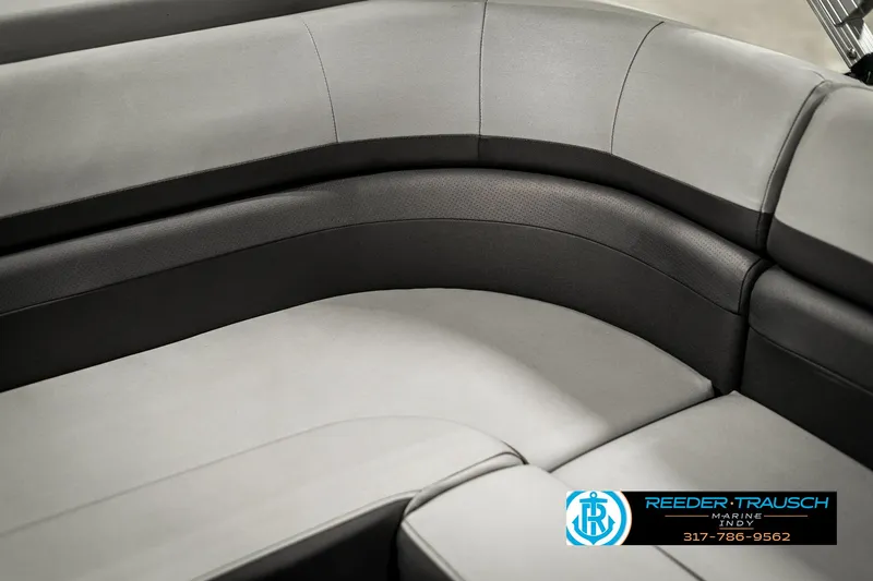 Slide: The Image of 2021 Bennington 22SX boat interior seating, gray and black upholstery, Reeder-Trausch Marine logo. - 44