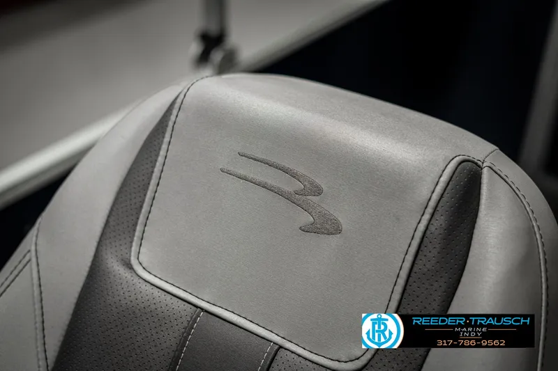 Slide: The Image of 2021 Bennington 22SX boat seat with logo, featuring gray upholstery. - 48