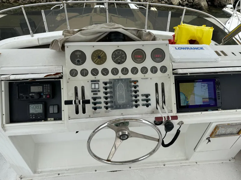 Slide: The Image of Control panel of a 1990 Trojan 40 Sport Fisherman 3208 Cat Diesel boat. - 8