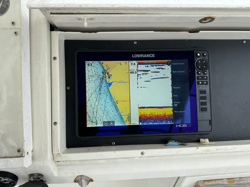 Slide: The Image of Lowrance marine GPS display on 1990 Trojan 40 Sport Fisherman boat dashboard. - 9