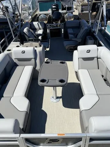 Slide: The Image of 2025 Princecraft VECTRA 23 XT/150 XL pontoon boat with spacious seating and modern design. - 1