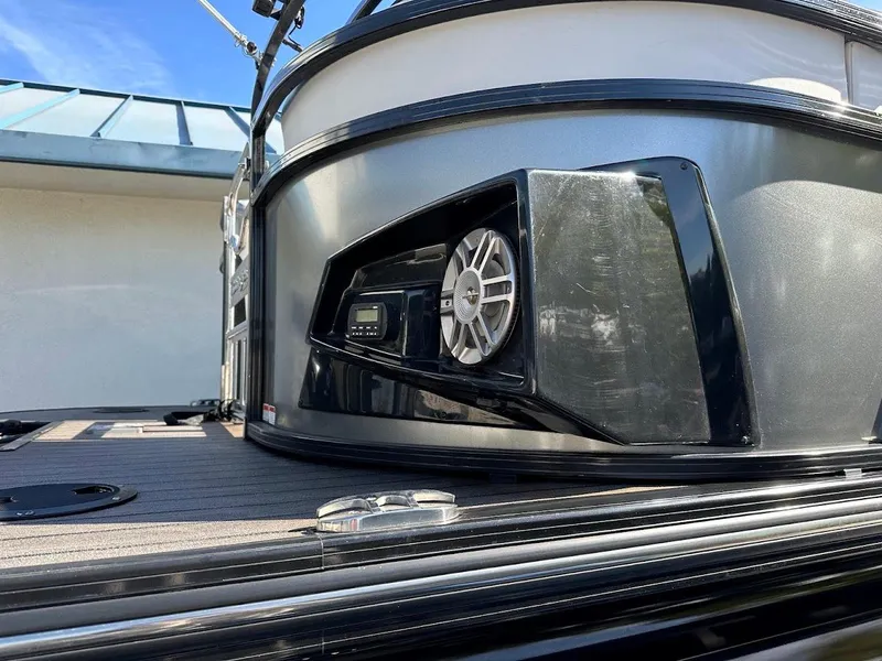 Slide: The Image of 2020 Ranger 2300LS boat with sleek black exterior and modern speaker system. - 13