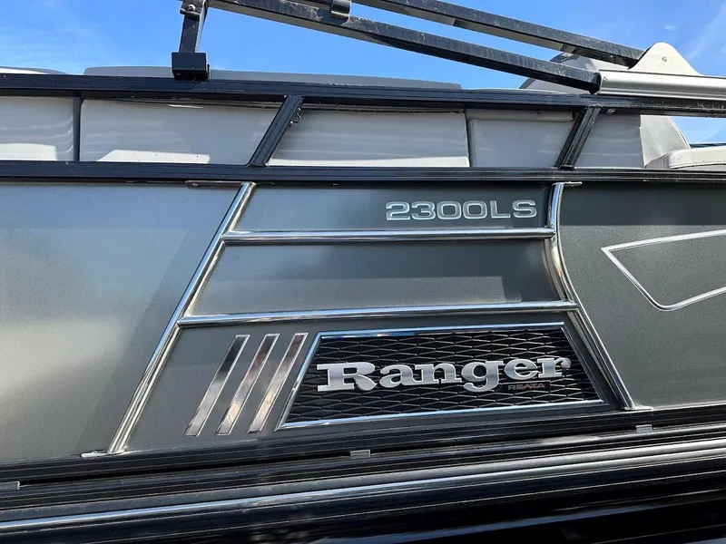 Slide: The Image of 2020 Ranger 2300LS boat exterior with sleek design and branding. - 14