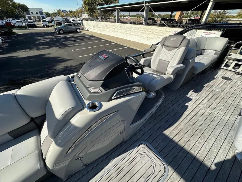 Slide: The Image of 2020 Ranger 2300LS boat interior with sleek seating and modern dashboard. - 18