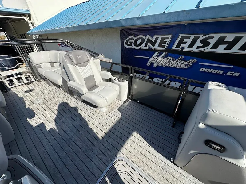 Slide: The Image of 2020 Ranger 2300LS boat interior with comfortable seating and "Gone Fishin'" banner. - 19