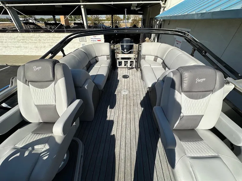 Slide: The Image of 2020 Ranger 2300LS boat interior with gray seating and spacious layout. - 20