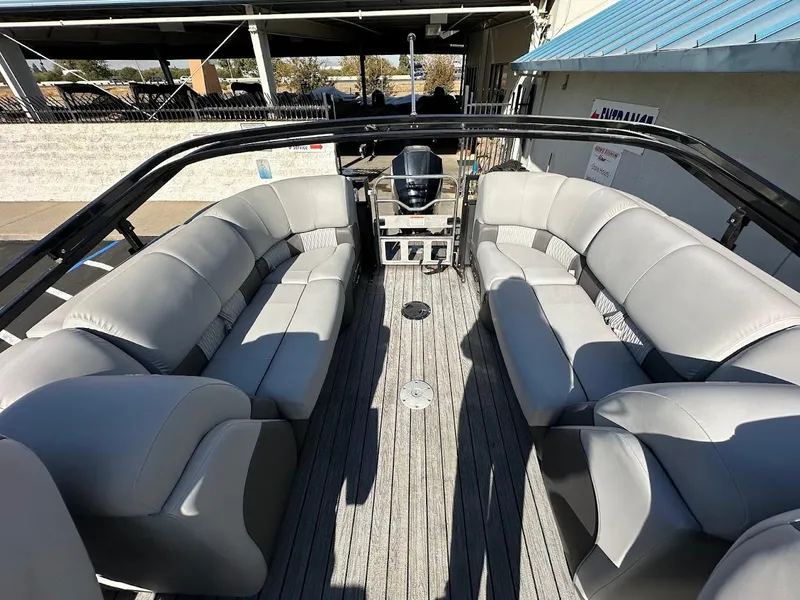 Slide: The Image of 2020 Ranger 2300LS boat interior with gray seating and wood flooring. - 21