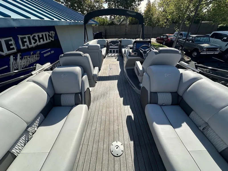 Slide: The Image of 2020 Ranger 2300LS pontoon boat with spacious seating and modern design. - 25