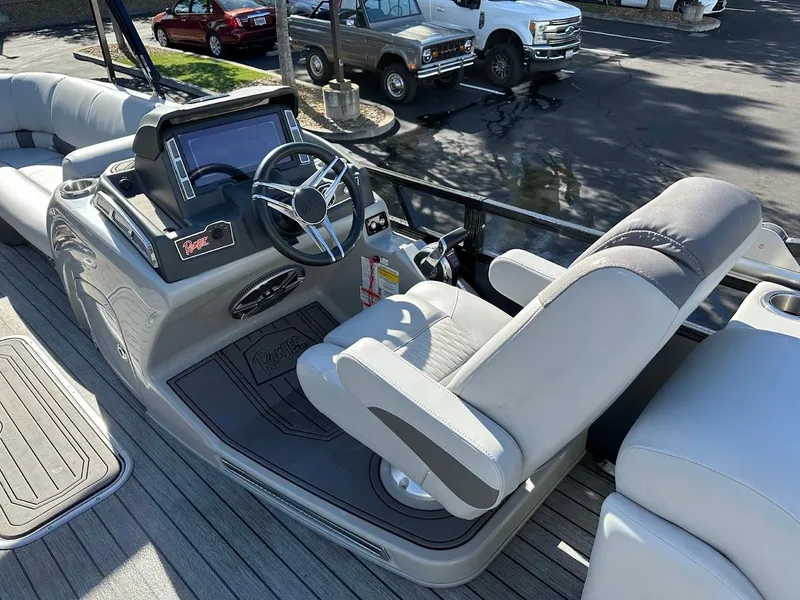 Slide: The Image of 2020 Ranger 2300LS boat interior with steering wheel and seating. - 27