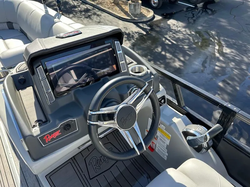 Slide: The Image of 2020 Ranger 2300LS boat dashboard with steering wheel and control panel. - 28