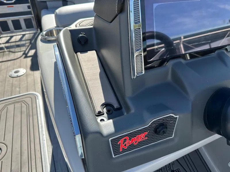 Slide: The Image of 2020 Ranger 2300LS boat dashboard with logo and steering wheel detail. - 30