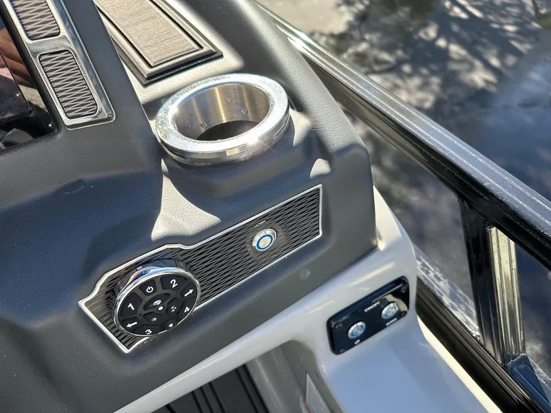 Slide: The Image of Ranger 2300LS 2020 boat dashboard with cup holder and control panel. - 31