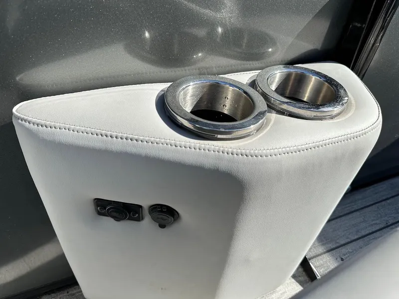 Slide: The Image of 2020 Ranger 2300LS boat interior with dual cup holders and control buttons. - 35
