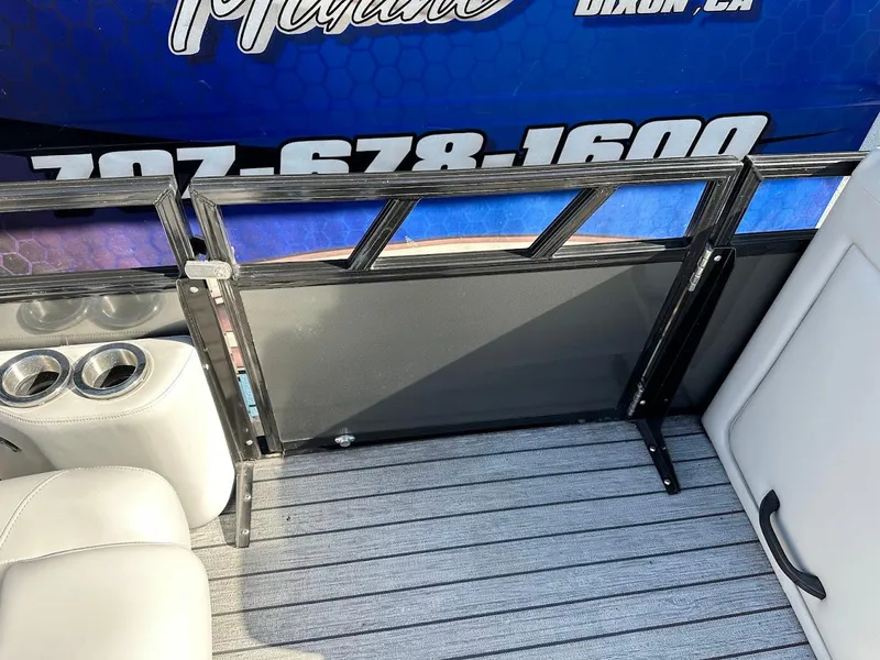 Slide: The Image of 2020 Ranger 2300LS boat interior with seating and cup holders. - 36