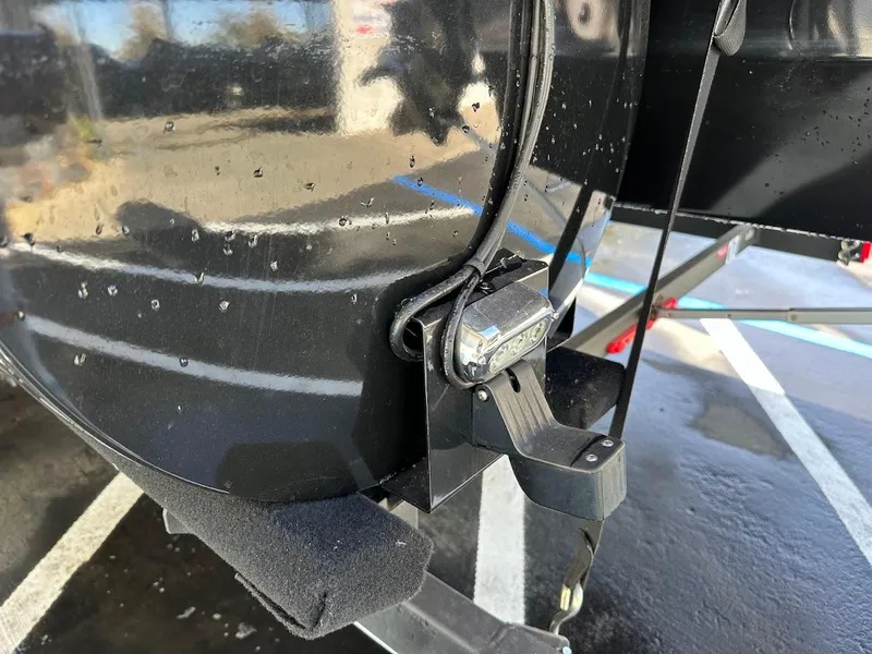 Slide: The Image of Close-up of a 2020 Ranger 2300LS boat trailer hitch in a parking lot. - 46