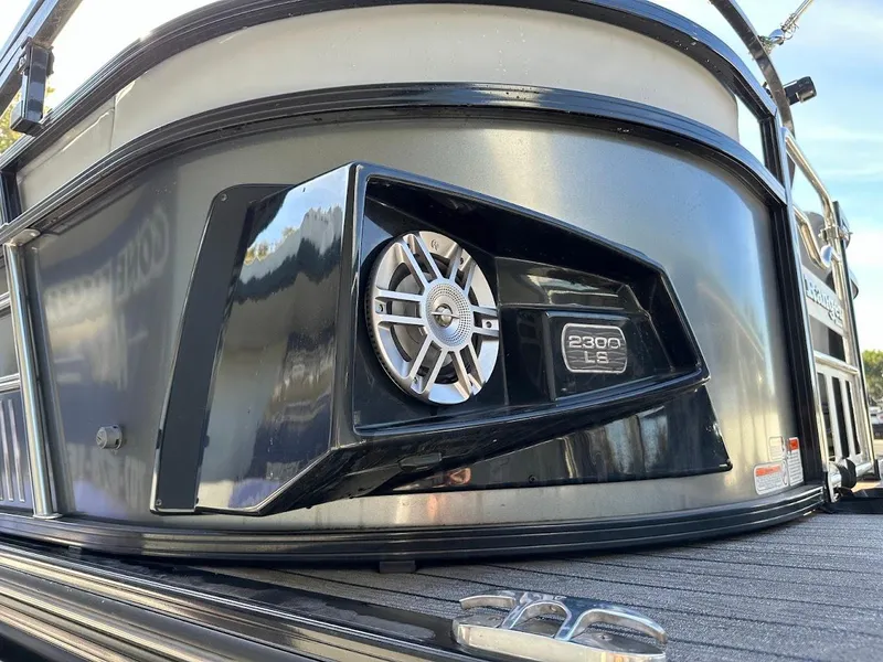 Slide: The Image of 2020 Ranger 2300LS boat with sleek black exterior and speaker detail. - 47