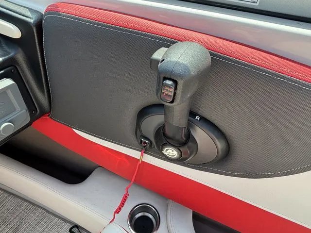 Slide: The Image of 2022 Crownline 210 SS boat on red trailer. - 27