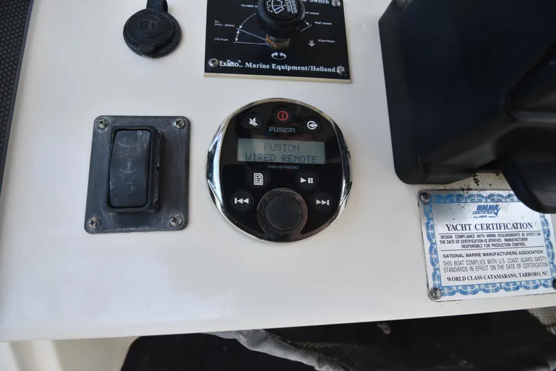 Slide: The Image of Control panel of 2008 World Cat 32 EC with Fusion wired remote and yacht certification. - 10